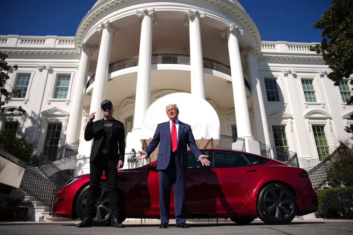 U.S. President Donald Trump and White House Senior Advisor, Tesla and SpaceX CEO Elon Musk deliver remarks next to a Tesla Model S on the South Lawn of the White House on March 11, 2025 in Washington, DC.