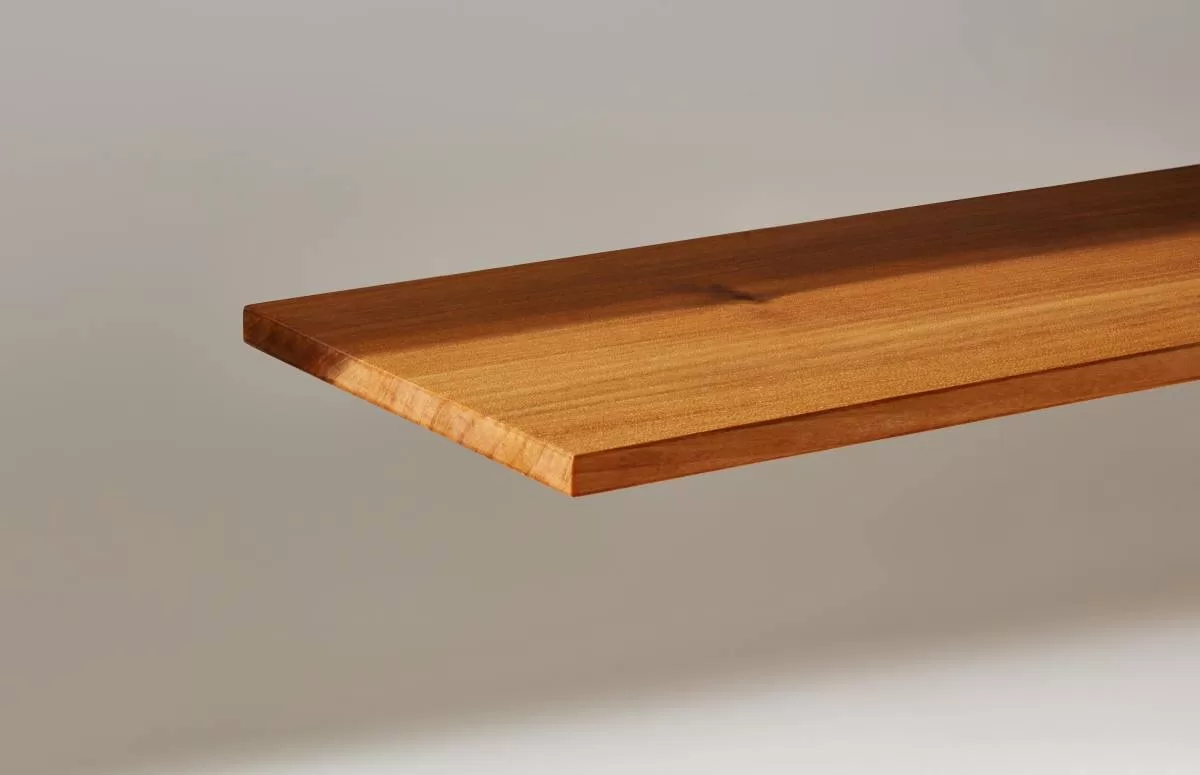 A plank of InventWood Superwood stands against a white background.