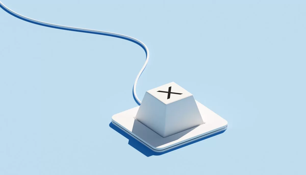 A keyboard with a single key featuring an "X" icon is set against a blue background. The "X" symbol typically represents rejection, cancellation, or incorrect choices, emphasizing decision-making processes. The minimalist design of the keyboard, combined with the vibrant blue backdrop, creates a modern look that highlights themes of selection and error management.