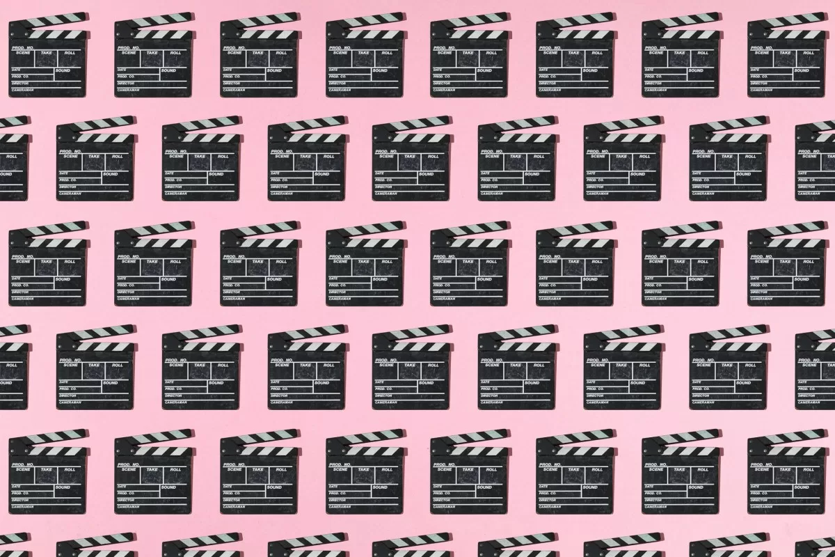 Wooden old movie clapperboard pattern with hard shadow on pink background. Concept of film industry, cinema, entertainment, and Hollywood.
