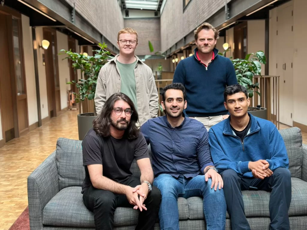 Hasan Sukkar (C) with his team at 11xAI.