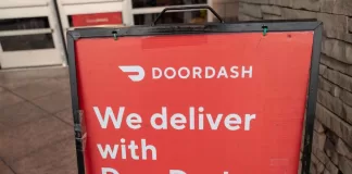 Sign reading We Deliver With Doordash, referencing the Doordash food delivery service, San Ramon, California, September 12, 2020. (Photo by Smith Collection/Gado/Getty Images)
