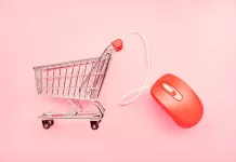 small shopping cart and red computer mouse