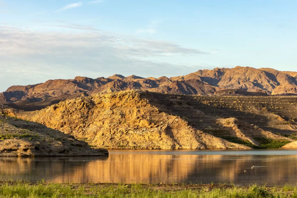 Image may contain Nature Outdoors Scenery Landscape Wilderness Mountain Mountain Range Water Lake and Peak