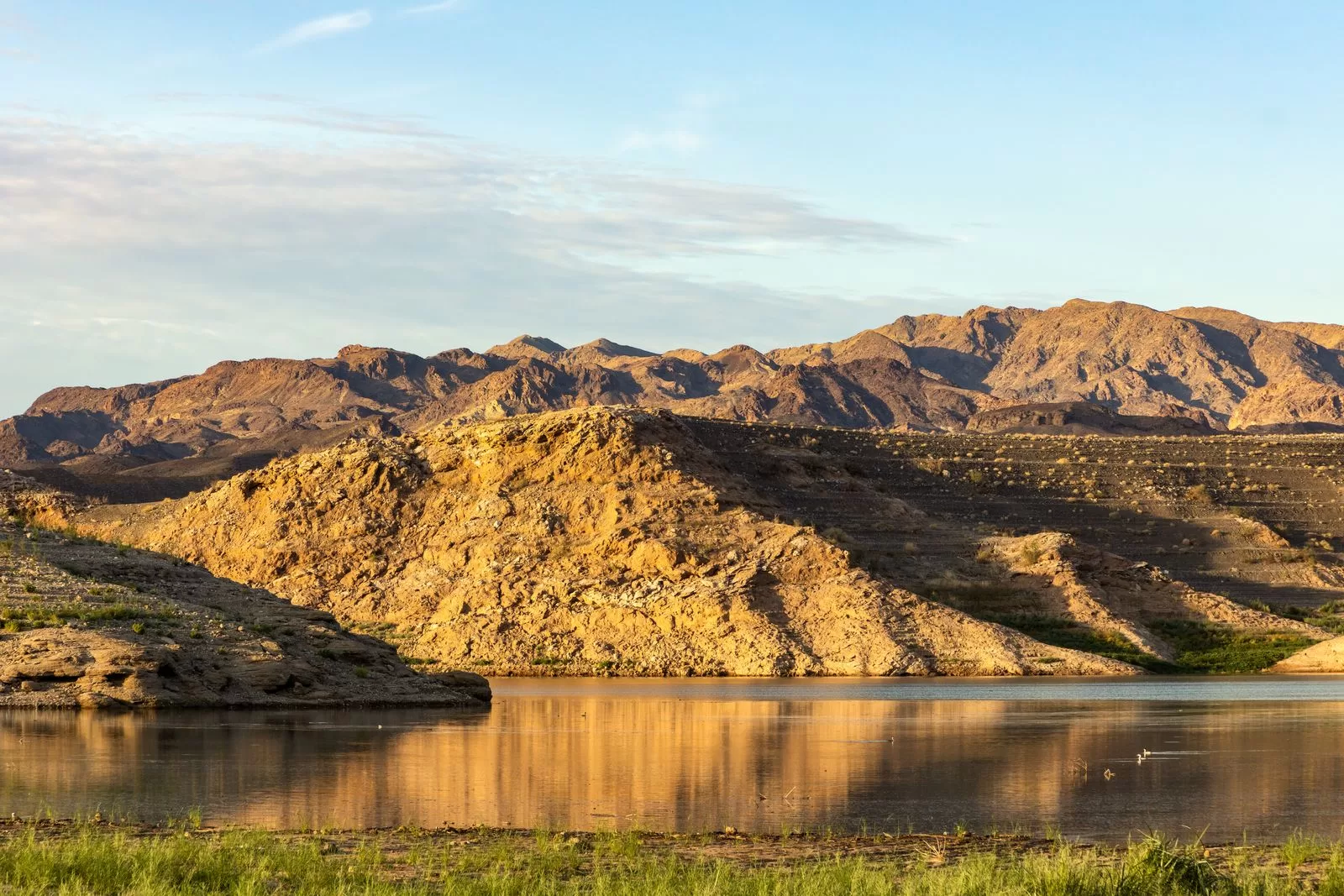 Image may contain Nature Outdoors Scenery Landscape Wilderness Mountain Mountain Range Water Lake and Peak