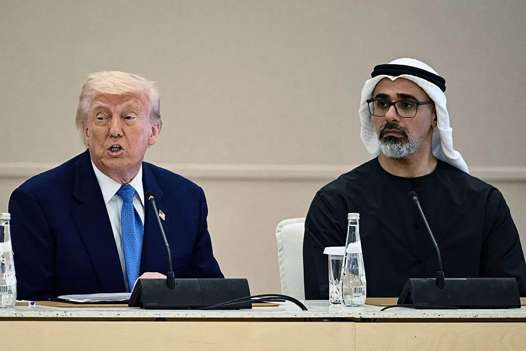 US President Donald Trump (L) speaks as he sits next to Abu Dhabi's Crown Prince Sheikh Khaled bin Mohamed bin Zayed Al Nahyan during the business dialogue forum in Abu Dhabi on May 16, 2025. The United Arab Emirates is the third leg of Trump's visit to the region, which has already taken him to Saudi Arabia and Qatar. (Photo by Brendan SMIALOWSKI / AFP) (Photo by BRENDAN SMIALOWSKI/AFP via Getty Images)