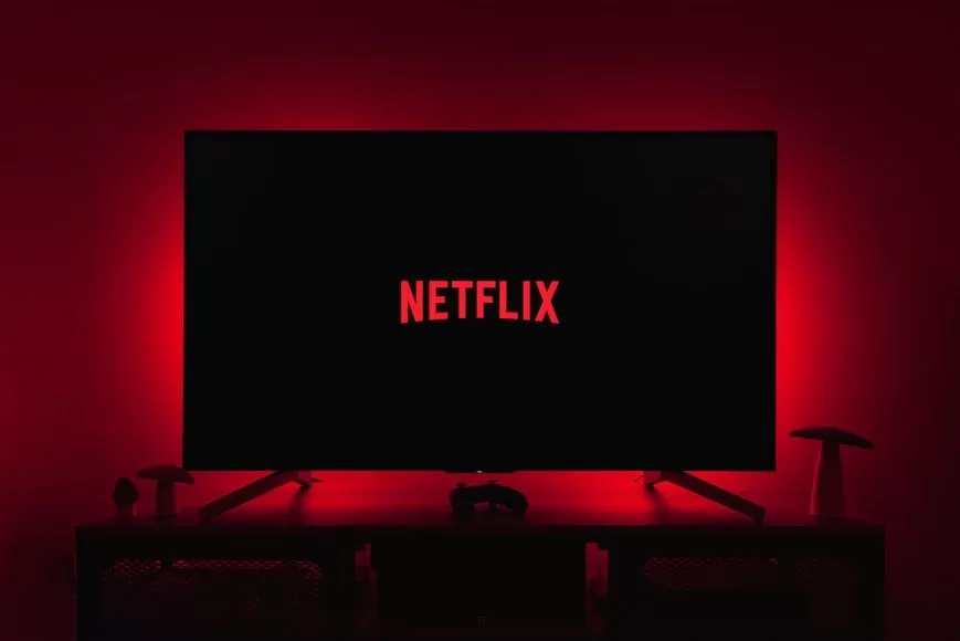 netflix logo on black screen backlit by red glow