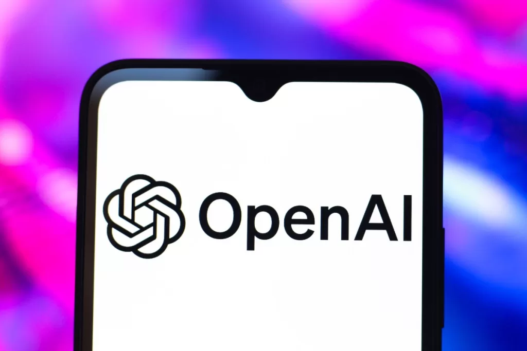 The OpenAI logo is seen displayed on a smartphone screen.
