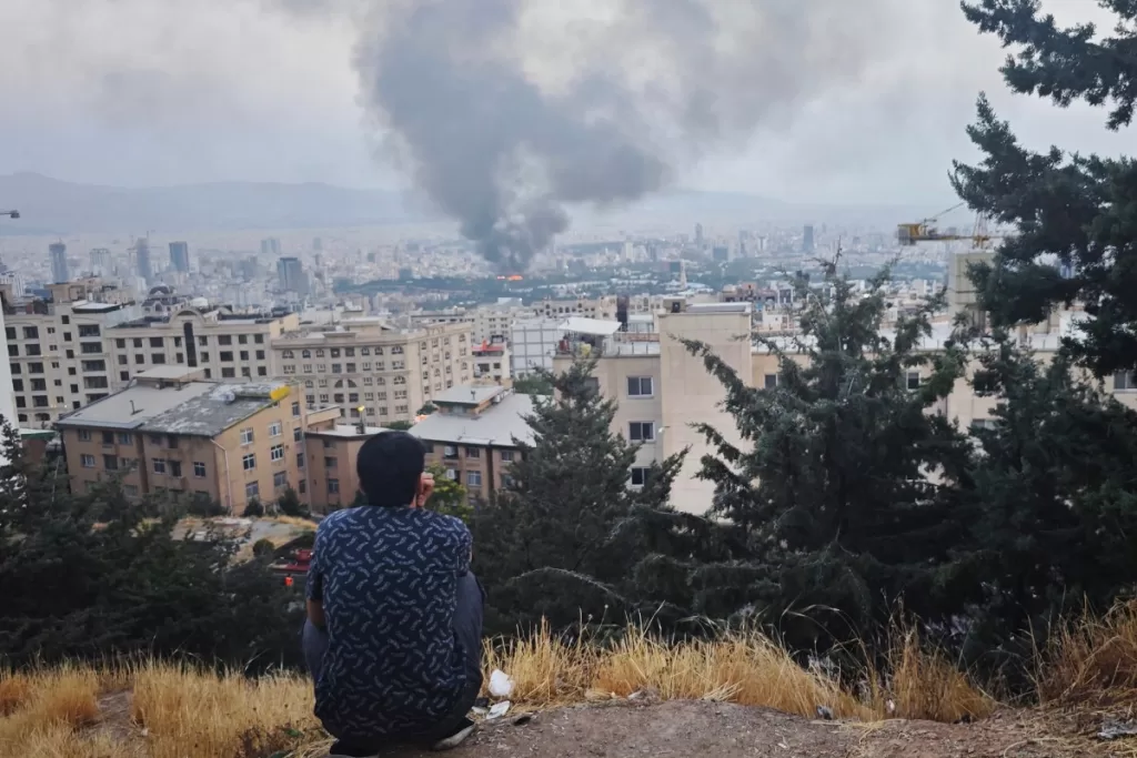 Smoke rises after a reported Israeli strike on a building used by Islamic Republic of Iran News Network, part of Iran's state TV broadcaster, on June 16, 2025 in Tehran, Iran.