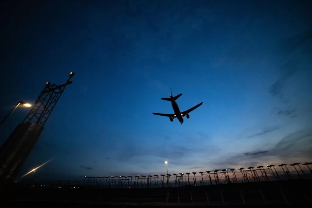 plan flying at dusk