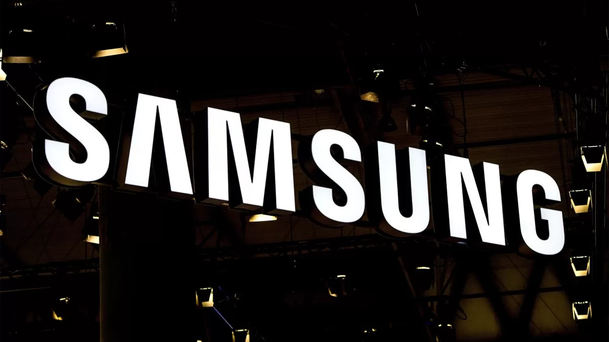 A logo sits illuminated outside the Samsung pavilion on the opening day of the World Mobile Congress