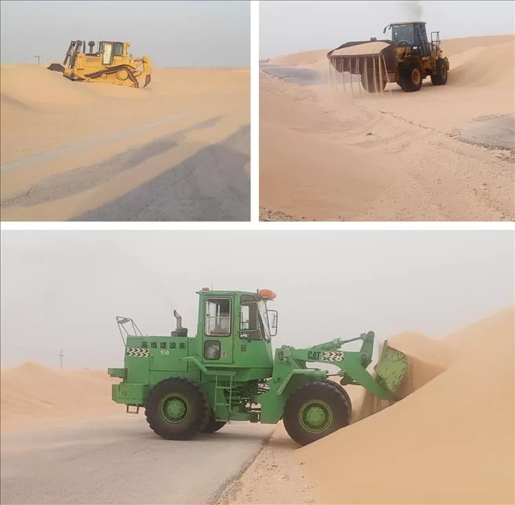 تواصل أعمال إزالة الرمال الزاحفة في منطقتي النشيمة وعرقة رغم اشتداد الرياح الموسمية