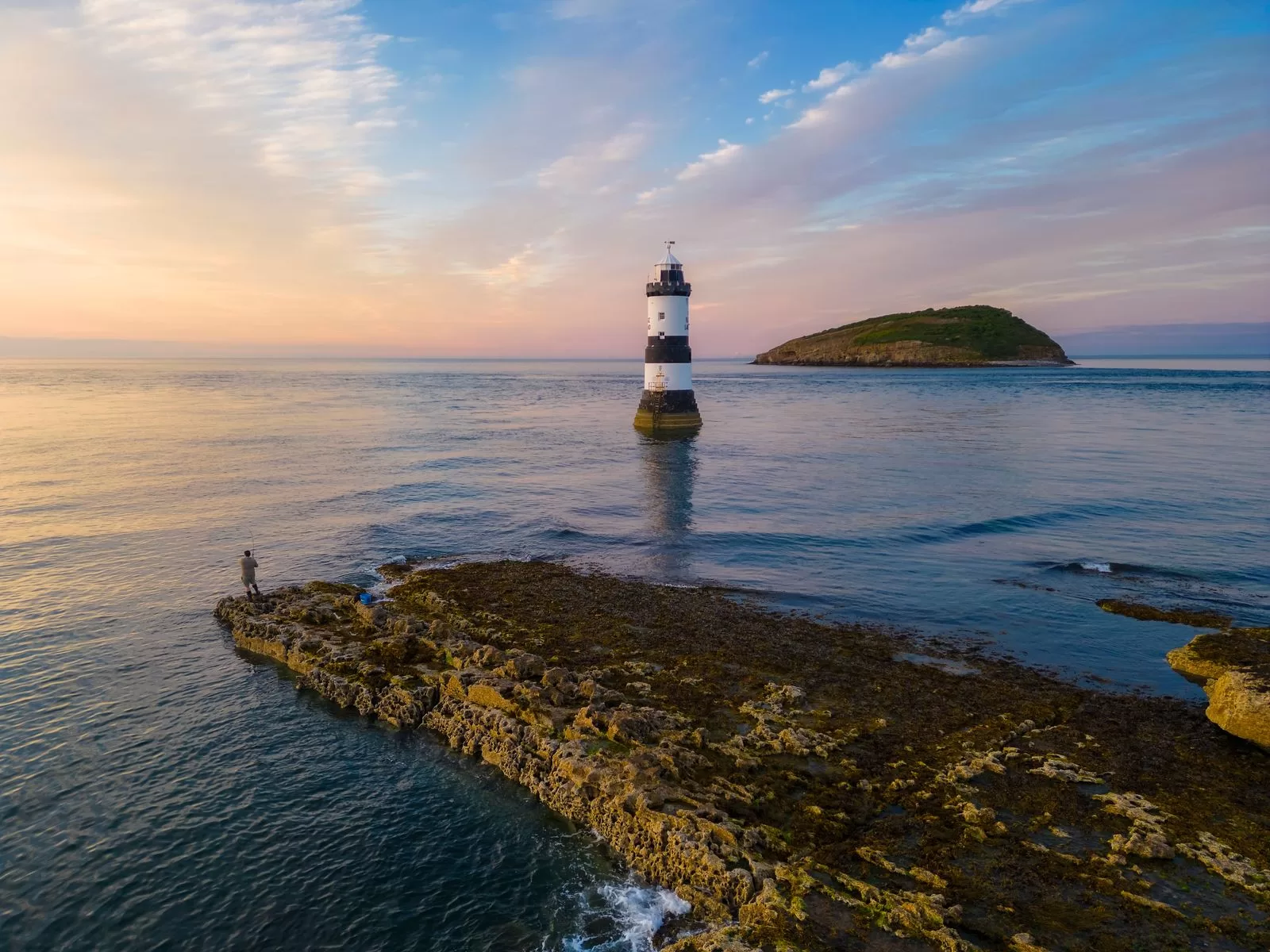 Image may contain Nature Outdoors Sea Water Sky Person Architecture Beacon Building Lighthouse Tower and Horizon