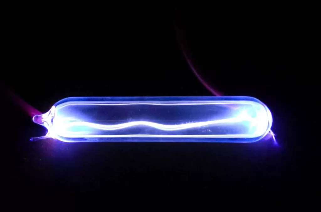 Electricity lights up krypton gas, showing a plasma discharge.