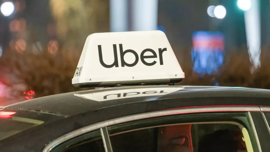 Uber logo on top of car