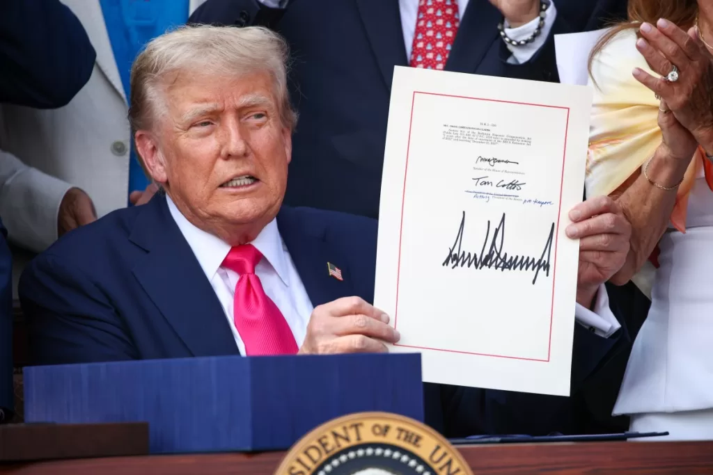U.S. President Donald Trump, joined by Republican lawmakers, signs the One, Big Beautiful Bill Act into law during an Independence Day military family picnic on the South Lawn of the White House on July 04, 2025 in Washington, DC.