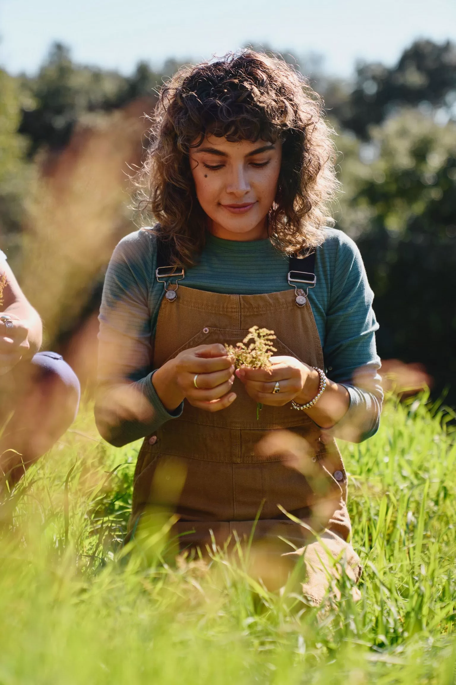 Image may contain Grass Plant Accessories Bracelet Jewelry Child Person Ring Face Head Photography and Portrait