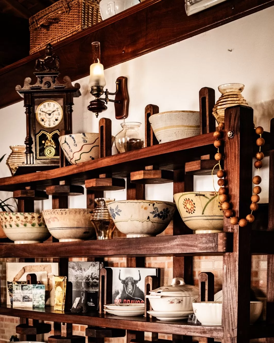 Image may contain Shelf Cabinet Furniture Indoors Interior Design Art Porcelain Pottery Wood Bread and Food