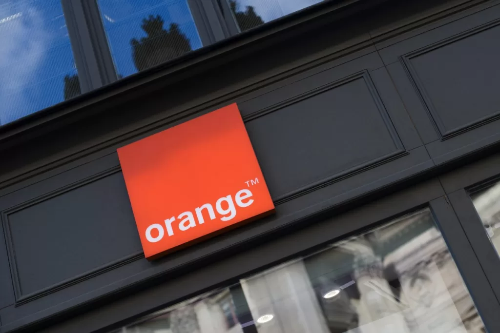 An Orange SA logo sits on display outside the Orange Paris Opera boutique mobile phone store in Paris, France, on Wednesday, July 29, 2020.