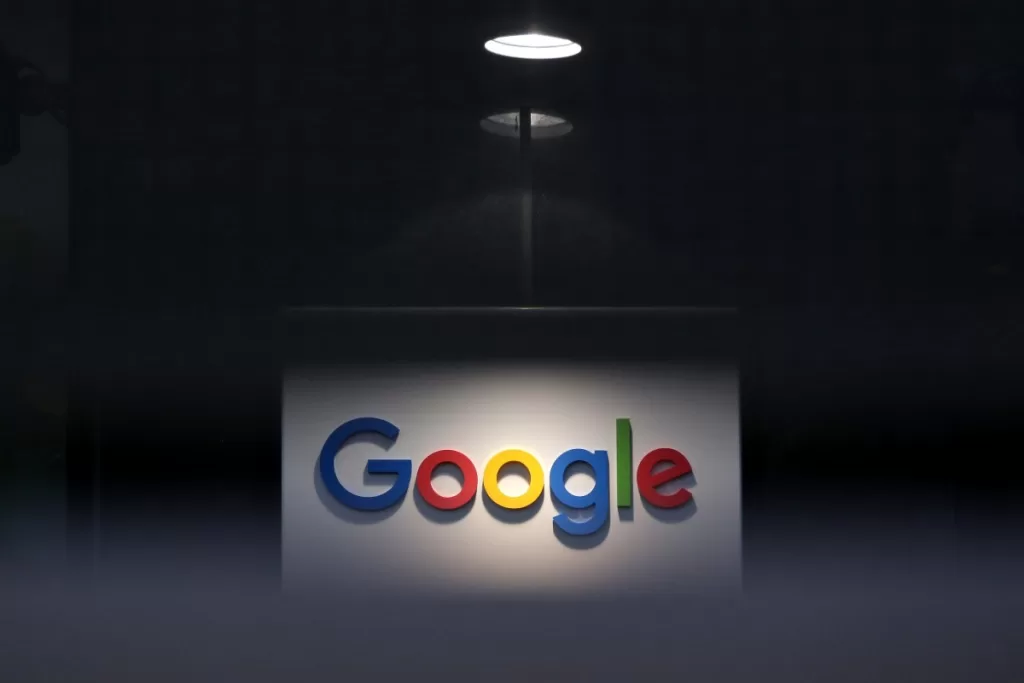 a photo of Google's logo on a dark background