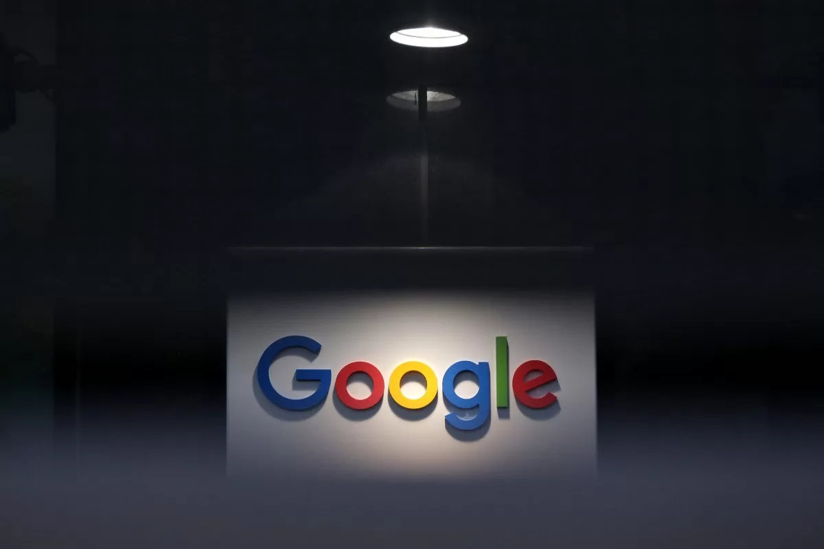 a photo of Google's logo on a dark background