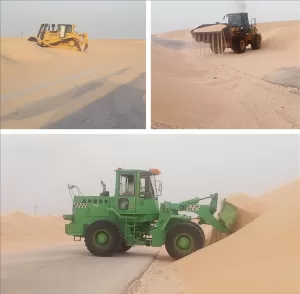 محافظات: استمرار جهود إزالة الرمال المتحركة في النشيمة وعرقة على الرغم من شدة الرياح