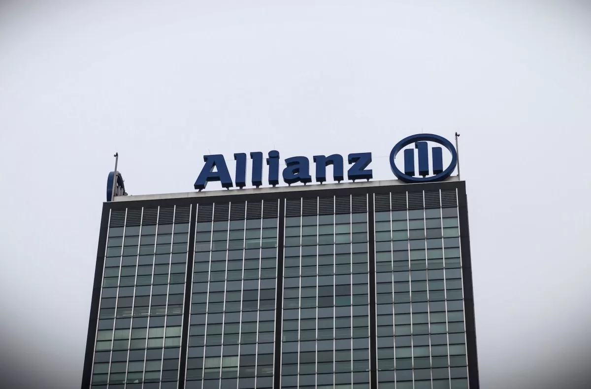 a photo of Allianz's logo at the top of a building.