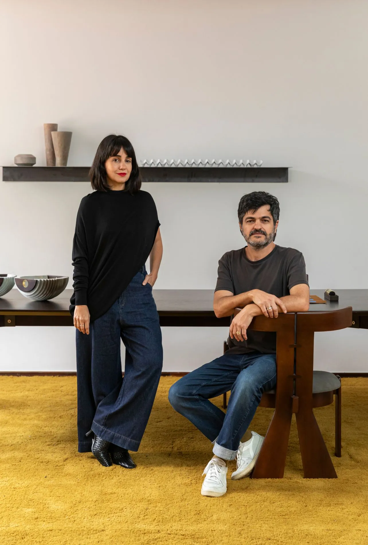 Image may contain Clothing Pants Adult Person Furniture and Table