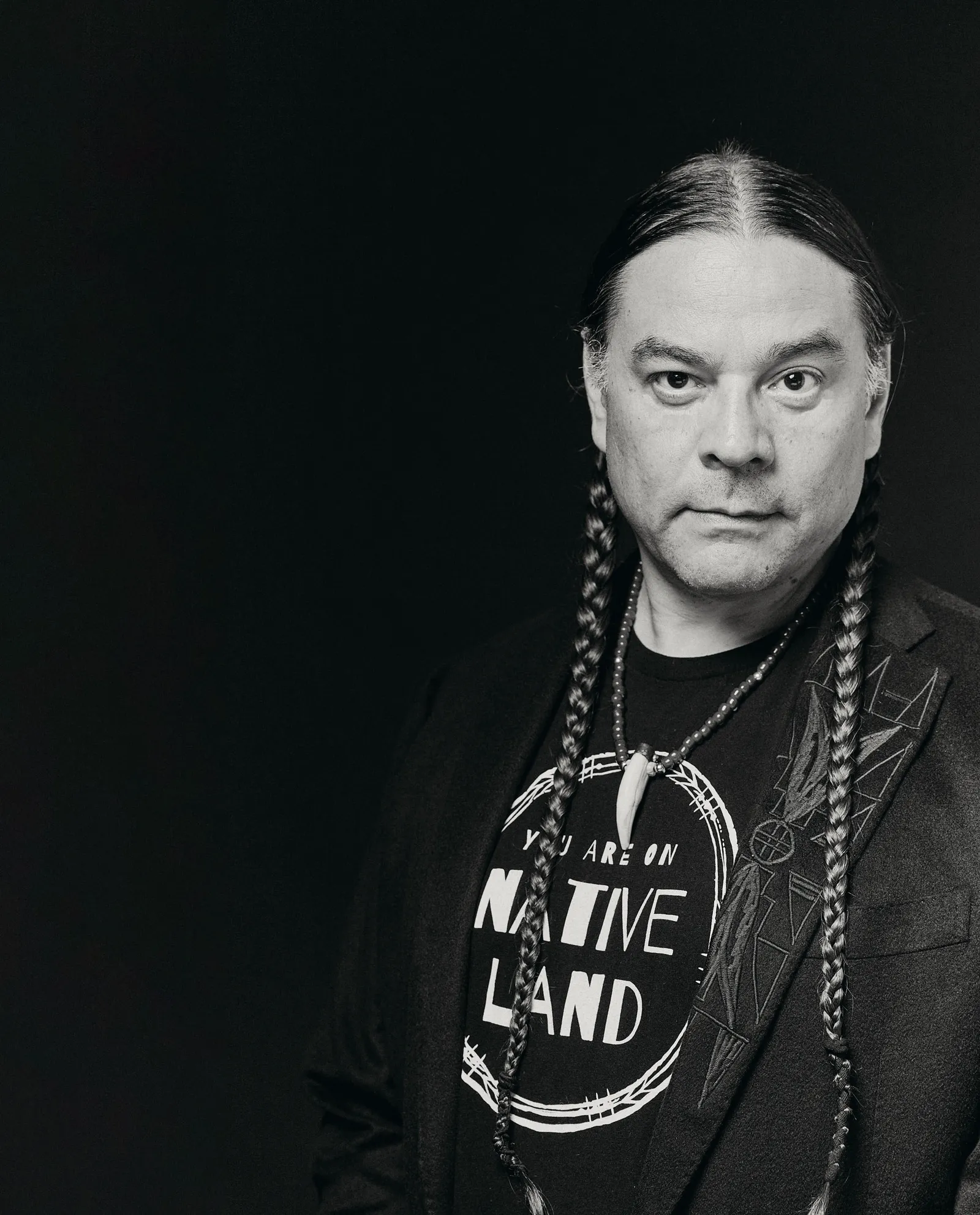 Image may contain Face Head Person Photography Portrait Accessories Jewelry Necklace Adult Braid and Hair