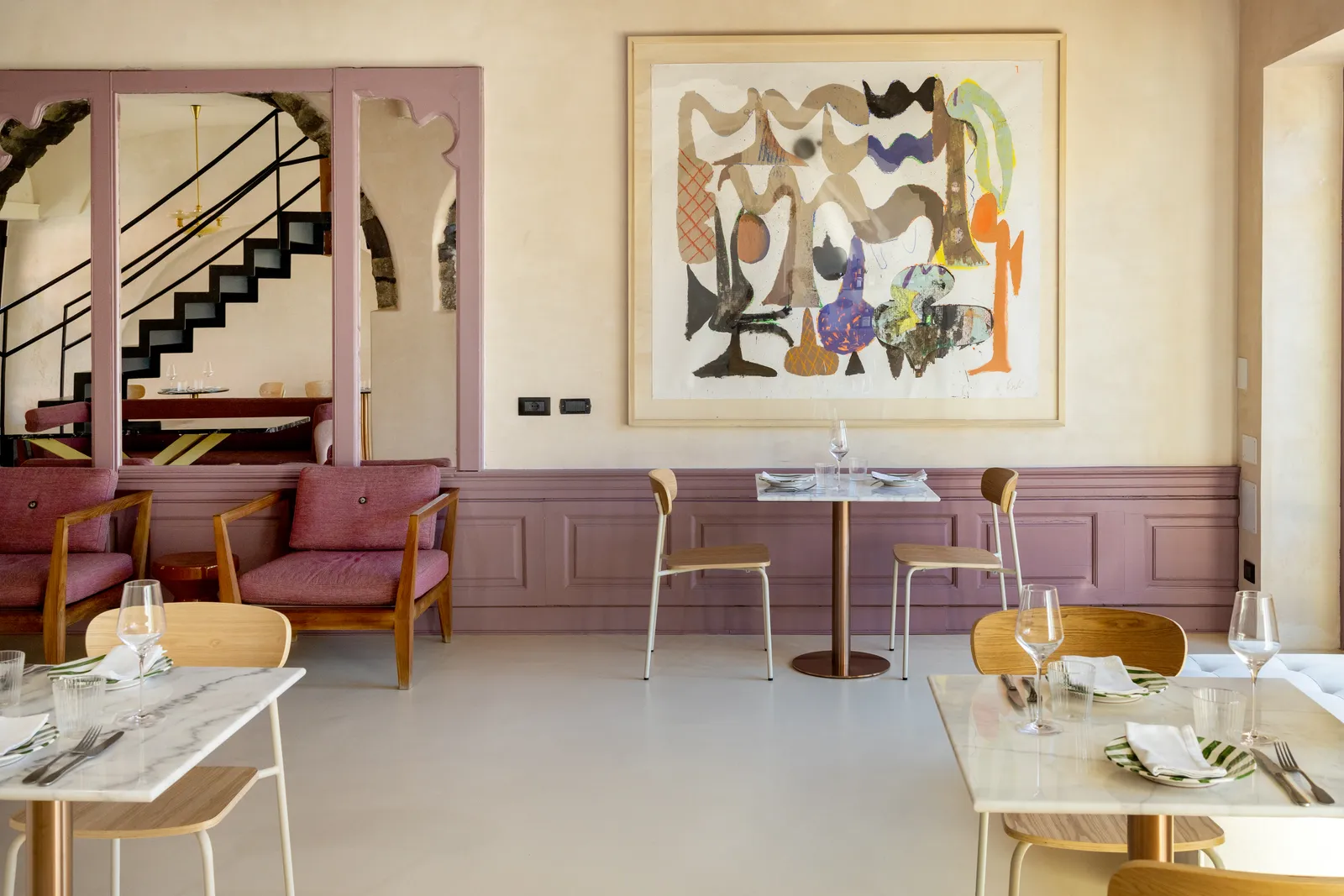 Image may contain Floor Indoors Interior Design Chair Furniture Art Painting Flooring Dining Table and Table