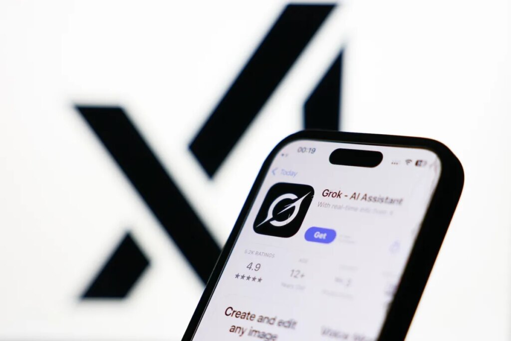 xAI logo displayed on a screen and Grok on App Store displayed on a phone screen