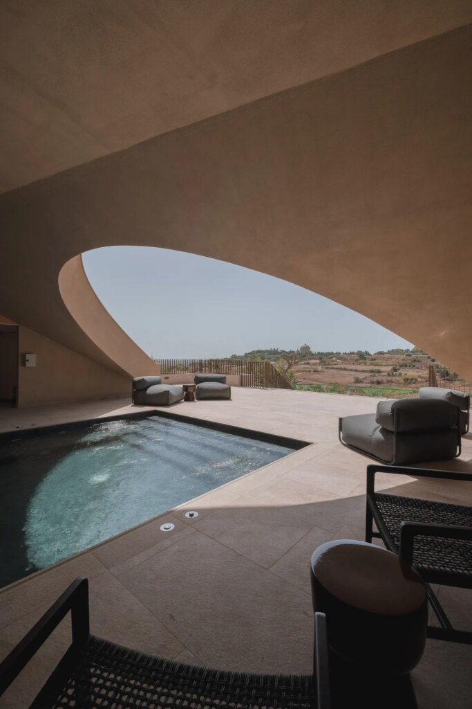 Image may contain Pool Water Swimming Pool Indoors Interior Design Chair Furniture Architecture Building and House
