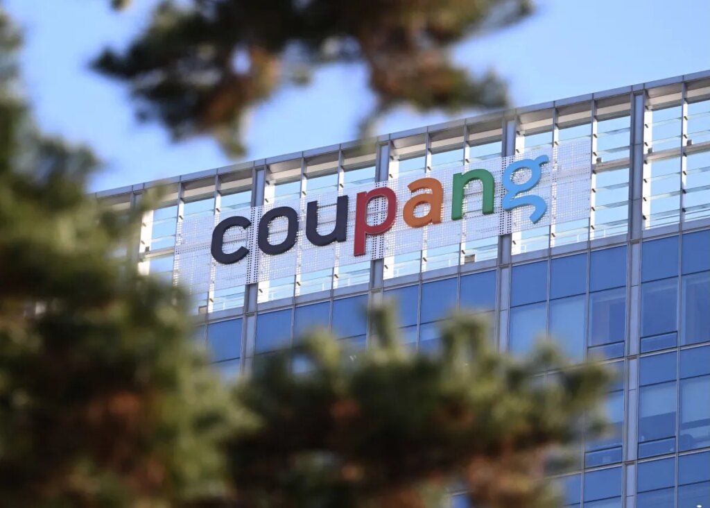 A general view shows the logo of South Korean online delivery service Coupang, at a building housing the headquarters of Coupang in Seoul on December 9, 2025. South Korean police raided the Seoul headquarters of e-commerce giant Coupang on December 9, over a recent data leak believed to have affected almost two-thirds of the country's population.