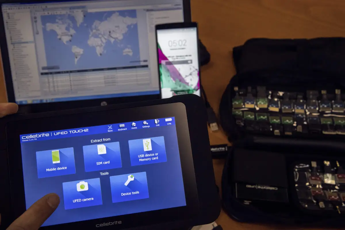An engineer shows devices and explains the technology developed by the Israeli firm Cellebrite.